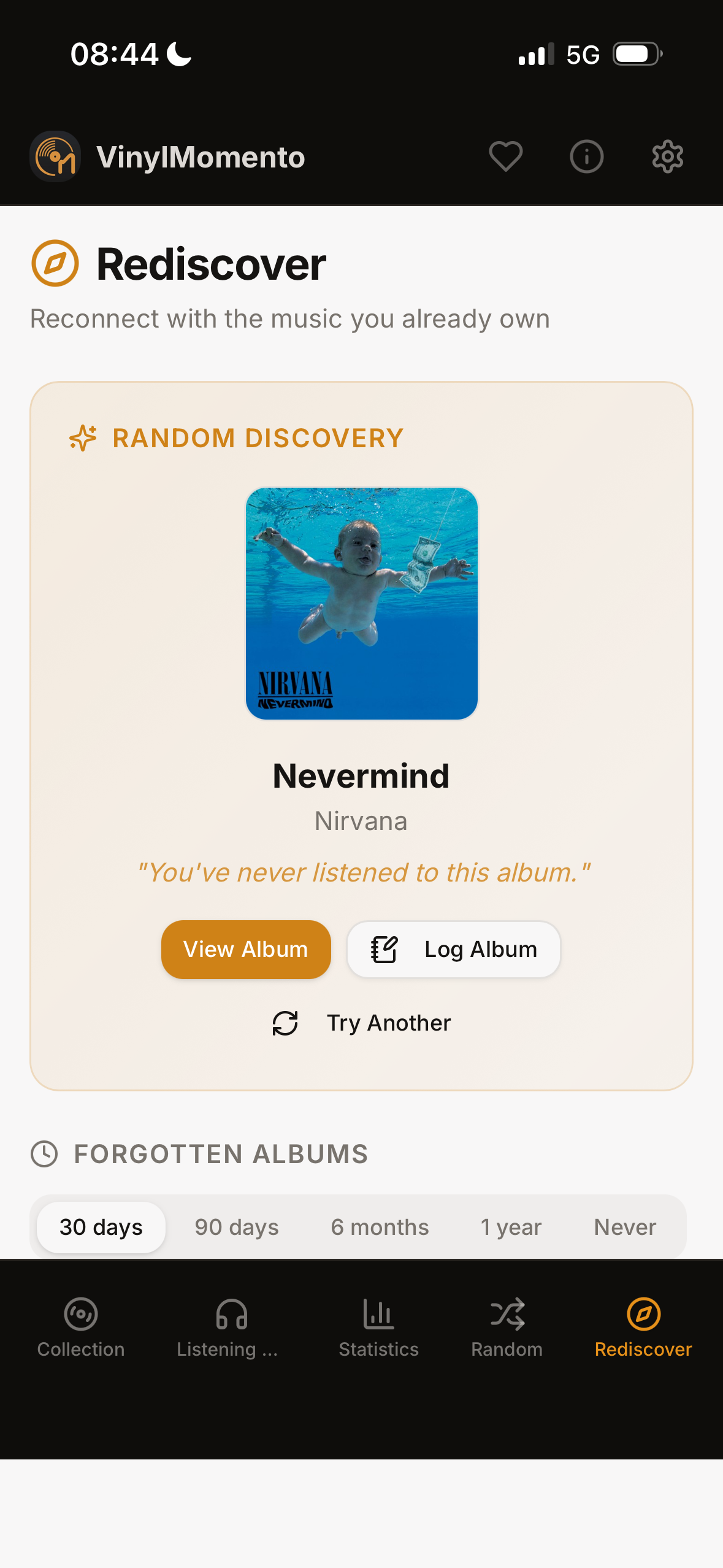 The VinylMomento Rediscover screen with a random album suggestion and a list of forgotten albums.